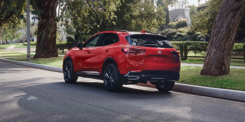 Red compact SUV parked along a quiet residential street